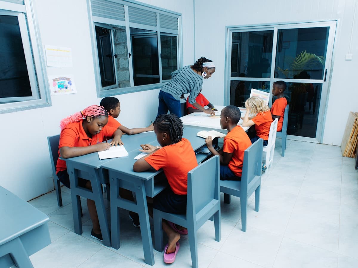 Teacher instructing students in a bright classroom
